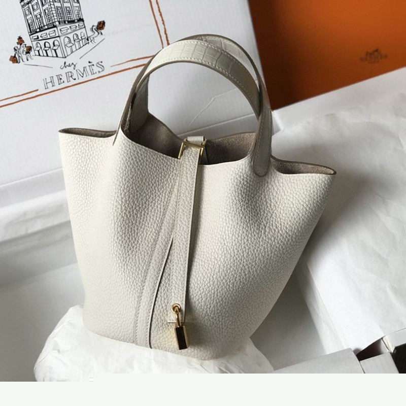 H**mes shopping bags